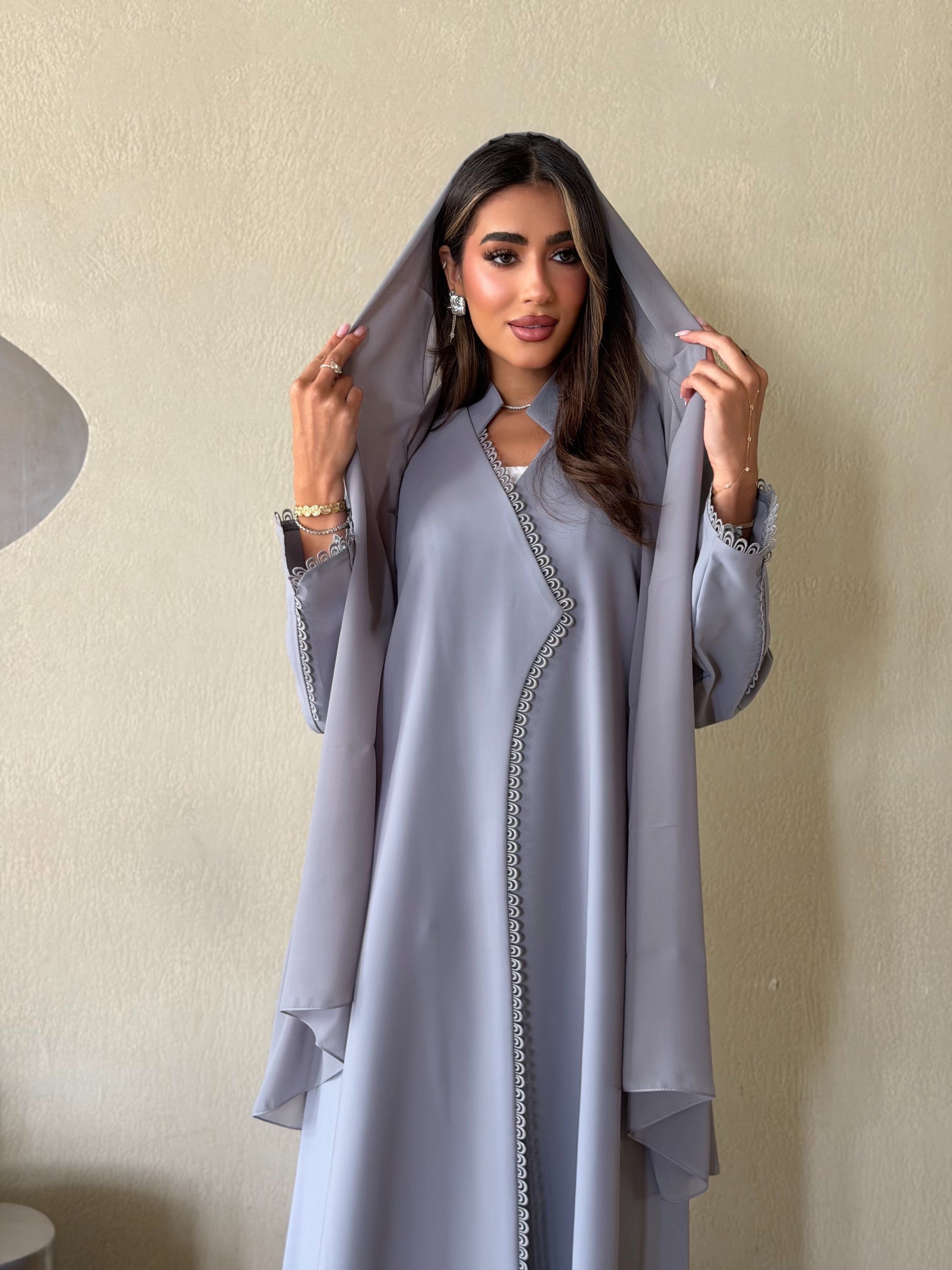 AT559 Gray Abaya      premium crepe fabric, elegant A-cut abaya features delicate lace detailing for a timeless, feminine look. Lightweight, comfortable, and perfect for work, everyday wear